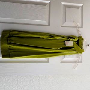 Green sleeveless top with bow neckline